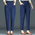 Fashionable mom jeans women's spring and summer harem radish pants high-waisted slim middle-aged casual women's cropped pants. 