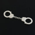 Manufacturers wholesale creative handcuff shape keychain metal small toy mini pendant car key ring gifts. 