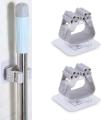 Self Adhesive Holder Wall Mounted Seamless Broom Hanger Clip Storage Racks.