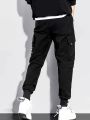 Workwear pants for men's spring and autumn styles with multiple pockets and ankle straps, casual and versatile cropped pants. 