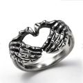 Vintage Punk Skull Hand with Heart-Shaped Ring for Men Women Hip Hop Gothic Skeleton Hand Ring Accessories Jewelry Gifts.