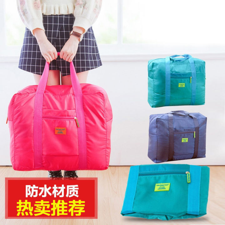 Travel bag, jacquard storage bag, travel storage clothing bag, large finishing bag, waterproof trolley handflower bag in the row
