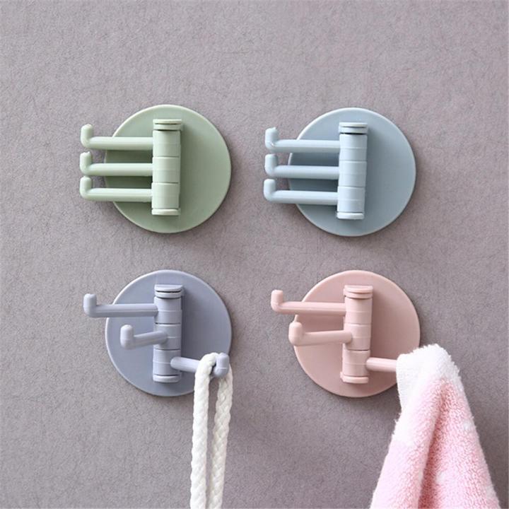 Multifunctional bathroom wall shelf free punching seamless trace rack rotating hook strong 3 branch rotating sticky hook
