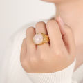 European and American new cross-border light luxury retro titanium steel plated 18K gold natural tiger's eye powder stone ring jewelry wholesale.