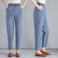 Fashionable mom jeans women's spring and summer harem radish pants high-waisted slim middle-aged casual women's cropped pants. 