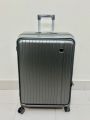 Modern Gunmetal Grey Hard-Shell Carry-On Luggage - Durable Ribbed ABS Spinner Suitcase with Telescopic Handle. 