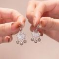 Douyin step by step, Chinese style, Ping An lock ear buckles, female tassels, bell earrings, temperament, light luxury earrings.