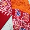 Red & orange colour combined mombatic bedsheets. 