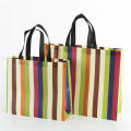 stripe Foldable handbag Stylish non-woven fabric Reusable shopper bag Eco-friendly tote bag for Travel Grocery shopping Outdoor activities Daily use Eco-conscious consumers. 