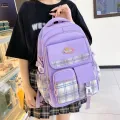 New children's school bag for primary school students 3-6 grade checkered color-blocking, ultra-lightweight burden reduction spine protection backpack for foreign trade. 