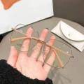 2023 New Eyeglasses: Popular European and American Women's Anti Blue Light Glasses Alloy Frame with Plain Face Fashion Matching Flat Light Glasses.