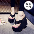 High heeled slippers for women in summer, thick soled herringbone beach shoes, sloping heels, clip on sandals, and sponge shoes. 