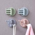 Multifunctional bathroom wall shelf free punching seamless trace rack rotating hook strong 3 branch rotating sticky hook.