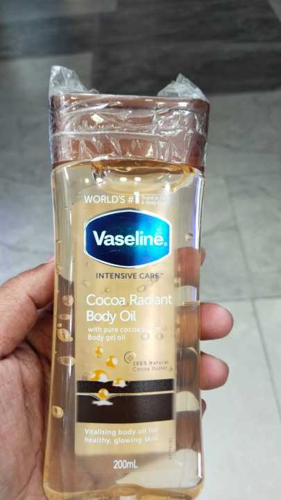 Vaseline%20Intensive%20Care%20Cocoa%20Radiant%20For%20Glowing%20Skin%20Body%20Gel%20Oil%20Body%20Oil%20Made%20with%20100%25%20Pure%20Cocoa%20Butter%20+%20Replenishing%20Oils%20-%20200ml%20-%20Image%202