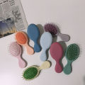 Mini children's airbag cushion massage generous curly hair sandalwood large curved cream glue DIY small comb home. 