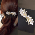 Nieuwe Koreaanse Oog Witte Kat Zirkoon Lente Haar Clip Parel Strik Boutique Legering Top Clip Elegante Vrouwen Mode haar Sieraden. 