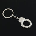 Manufacturers wholesale creative handcuff shape keychain metal small toy mini pendant car key ring gifts. 