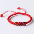 charm detail Ethnic bracelet Stylish Adjustable size Handmade rope material Woven amulet bracelet Ethnic design Woven craftsmanship Adjustable bracelet for wear Yoga and meditation Ethnic fashion. 