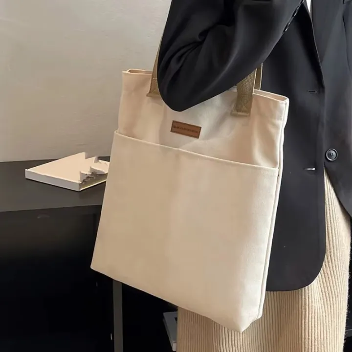 TAG%20Lifestyle%20Canvas%20Tote%20Bag/Fashionable%20Top%20Handle%20Off%20White%20Color%20With%202%20Big%20Outside%20Pocket%20and%20Zipper%20Enclosure%20for%20girls%20For%20University/College/Trendy%20Fashionable%20Women%20-%20Image%209