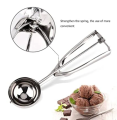stainless steel ice cream scoop spoon with a trigger release mechanism..