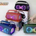 ET-313 Bluetooth, AUX, USB, TF Card & FM Radio Supported Hi-Fi Sound Colorful Lighting Party Bass Speaker With FM Radio. 