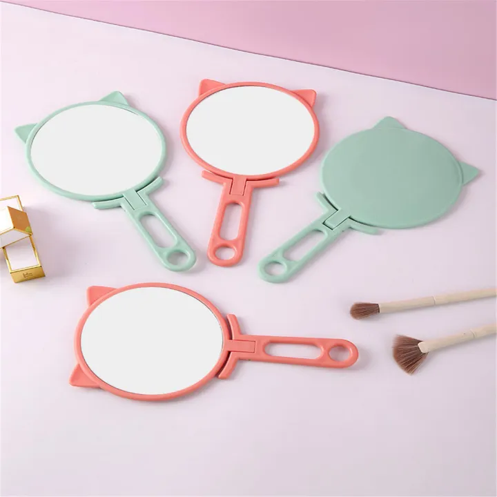 lens%20Hand-held%20makeup%20mirror%20Magnifying%20plastic%20Portable%20mirror%20Folding%20handle%20make-up%20mirror%20for%20Travel%20Daily%20makeup%20routine%20Beauty%20professionals%20Makeup%20enthusiasts%20Gift%20option%20-%20Image%207