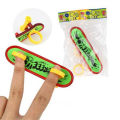 Mini Plastic Fingerboard Professional finger skateboard for kids novelty items Toy Finger Skate with spring and ring. 