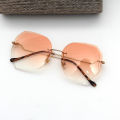 Qianai new fashion hipster cut edge sunglasses women's irregular fashion rimless ocean piece sunglasses driving mirrors.