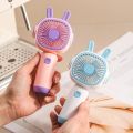 New Handheld Small Fan with Base Cartoon Style Simple Operation Student Mini Home Charging Portable Air Conditioner. 