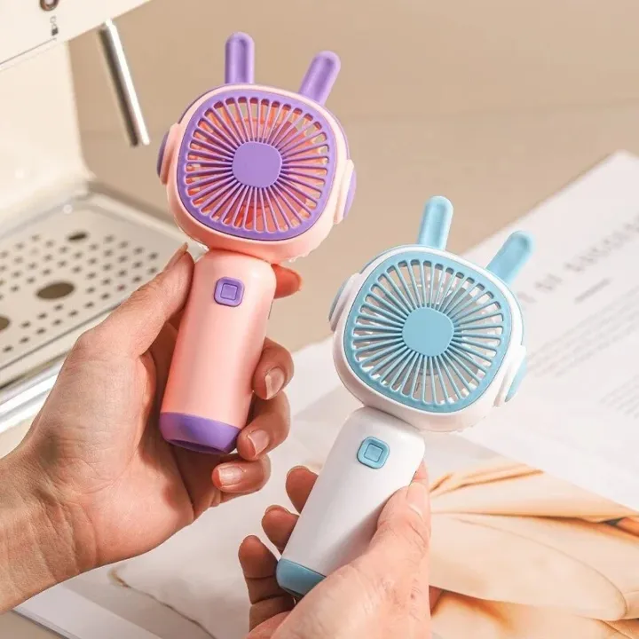 New%20Handheld%20Small%20Fan%20with%20Base%20Cartoon%20Style%20Simple%20Operation%20Student%20Mini%20Home%20Charging%20Portable%20Air%20Conditioner%20-%20Image%203