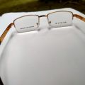 Golden half cot chosma freme full metal italian.Stay Stylish with Golden-framed Glasses: Shop Now on Daraz!". 