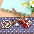 rhinestone small guitar car keychain female Korean version creative bag pendant metal key chain ring foreign trade gifts wholesale.