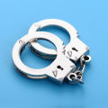 Manufacturers wholesale creative handcuff shape keychain metal small toy mini pendant car key ring gifts. 