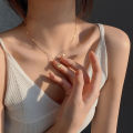 Light luxury love love titanium steel necklace women's versatile new clavicle chain plated 18K gold simple temperament peach heart necklace.