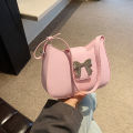 This year's popular bow handbag bag women's 2024 spring and summer new fashion foreign shoulder armpit small square bag. 