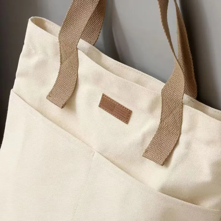 TAG%20Lifestyle%20Canvas%20Tote%20Bag/Fashionable%20Top%20Handle%20Off%20White%20Color%20With%202%20Big%20Outside%20Pocket%20and%20Zipper%20Enclosure%20for%20girls%20For%20University/College/Trendy%20Fashionable%20Women%20-%20Image%202