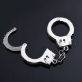Manufacturers wholesale creative handcuff shape keychain metal small toy mini pendant car key ring gifts. 