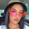 Luxury Fashion Fire Flame Sunglasses Women Rimless Wave Sun Glasses Metal Shades For Vintage Women Mirror Eyewear UV400. 