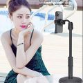 Desktop mobile phone holder stand 360 rotate for live streaming shoot youtube tiktok video round base smartphone.