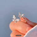 BUTTERFLY RING SPARKLY VERY PRETTY COLOUR CATCHING TIBETAN SILVER ADJUSTABLE.