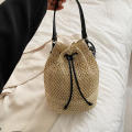 Eco-Friendly Bamboo Handle Straw Bag Chic Natural Lightweight Handmade Bamboo Woven Handbag Sustainable Handcrafted Handmade Straw Woven Beach Bag for Beach Vacations Summer Outings Casual Gatherings. 