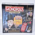 New Monopoly bord game Super Electronic Board Game, Electronic Banking Unit, Choose Your Rewards, Cashless Gameplay Tap Technology, for Ages 8 and Up,Box English electronic monopoly. 