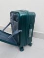 Elegant Forest Green Hard-Shell Spinner Suitcase - Lightweight ABS Carry-On Luggage with Ribbed Finish and Telescopic Handle. 