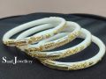 White Shakha Pola Bangles for Women 4 Pcs Plastic. Party , Wedding , Anniversary , Druga Puja & All Time Use Sakha Bangles. Model:CD160.. 