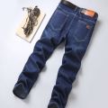 2022 Fitted Straight Stretch Denim Jeans Classic Style Badge Youth Men's Business Casual Jeans Trousers.