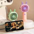New Handheld Small Fan with Base Cartoon Style Simple Operation Student Mini Home Charging Portable Air Conditioner. 