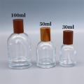 30ml-100ml Glass perfume bottle Portable Wood Cap Glass material Spray bottle Fine Mist Sub-bottle for Daily use Travel Cosmetic storage. 