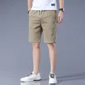Woodpecker Ice Silk Shorts Men's Summer Thin Trendy Bermuda Shorts Loose Men's Denim Shorts Workwear Fashion. 