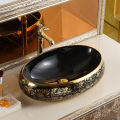 High Quality Luxury Modern Oval Art Basin Ceramic Gold Black Bathroom Sink Counter Top Hand Wash Basin. 
