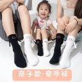 Hand in hand socks magnetic male and female baby socks cute funny smiling face tide cartoon net red handle. 
